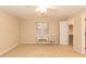 Bright bedroom with carpet, large window, and walk-in closet at 6700 Chauncey Dr, Raleigh, NC 27615