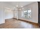 Bright dining room with hardwood floors and views to other rooms at 824 Crimson Ridge Trl, Fuquay Varina, NC 27526