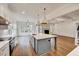 Spacious kitchen with island, stainless steel appliances, and hardwood floors at 824 Crimson Ridge Trl, Fuquay Varina, NC 27526