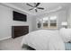 Bright bedroom with a large bed, dresser, and large windows at 8909 Hopkins Knob Ct, Zebulon, NC 27597