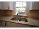 Double stainless steel sink and granite countertops at 1013 Red Hat Ln, Durham, NC 27713