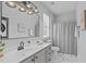 Modern bathroom features a stylish vanity with an illuminated mirror and walk-in shower at 105 Fountain Ridge Pl, Holly Springs, NC 27540