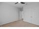 Neutral bedroom with a closet, open door, and carpeted flooring at 105 Fountain Ridge Pl, Holly Springs, NC 27540
