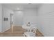 Cozy dining area featuring hardwood floors, white walls, and a peaceful setting at 105 Fountain Ridge Pl, Holly Springs, NC 27540