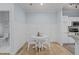 Small dining area with white table and chairs near kitchen at 105 Fountain Ridge Pl, Holly Springs, NC 27540