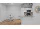 Bright kitchen features a dining set, stainless steel appliances, granite countertops and natural wood flooring at 105 Fountain Ridge Pl, Holly Springs, NC 27540