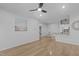 Open-concept living room with hardwood floors and view to kitchen and dining area at 105 Fountain Ridge Pl, Holly Springs, NC 27540