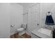 Updated bathroom with granite vanity and wood-look flooring at 1200 Rogers Rd, Graham, NC 27253