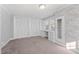 Cozy bedroom with built-in desk and white closet at 1200 Rogers Rd, Graham, NC 27253