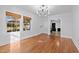 Formal dining room with hardwood floors and access to the living room at 1200 Rogers Rd, Graham, NC 27253