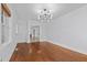 Formal dining room with hardwood floors and access to the living room at 1200 Rogers Rd, Graham, NC 27253