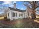Charming house with gray siding, landscaped yard, and a spacious front porch at 1200 Rogers Rd, Graham, NC 27253