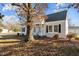 Gray house with white trim, landscaping, and a walkway to the front door at 1200 Rogers Rd, Graham, NC 27253