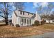 House with a sunroom and brick accents, surrounded by a well-maintained lawn at 1200 Rogers Rd, Graham, NC 27253