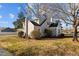 Side view of charming gray house with green lawn at 1200 Rogers Rd, Graham, NC 27253