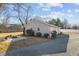 Detached garage with a single door and additional storage space at 1200 Rogers Rd, Graham, NC 27253
