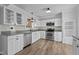 Updated kitchen, featuring white cabinets and granite countertops at 1200 Rogers Rd, Graham, NC 27253