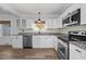 Modern kitchen with stainless steel appliances and granite countertops at 1200 Rogers Rd, Graham, NC 27253