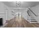 Bright living room features hardwood floors, a fireplace, and an open concept floorplan at 1200 Rogers Rd, Graham, NC 27253