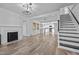 Bright living room features hardwood floors, a fireplace, and an open concept floorplan at 1200 Rogers Rd, Graham, NC 27253