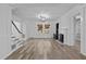 Spacious living room with hardwood floors, fireplace and large windows at 1200 Rogers Rd, Graham, NC 27253
