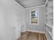 Bright office with built-in shelves and desk at 1200 Rogers Rd, Graham, NC 27253
