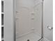 Clean shower stall with built-in shelves at 1200 Rogers Rd, Graham, NC 27253
