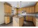 Kitchen with wood cabinets and granite countertops at 1216 Magnolia Hill Rd, Garner, NC 27529