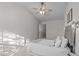 Spacious bedroom with a plush bed and ample natural light at 1316 Holly Grove Way, Durham, NC 27713