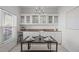Bright dining area with built-in cabinetry and seating for four at 1316 Holly Grove Way, Durham, NC 27713