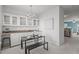 Dining area with built-in cabinetry and modern chandelier at 1316 Holly Grove Way, Durham, NC 27713