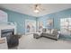 Living room with fireplace and access to back patio at 1316 Holly Grove Way, Durham, NC 27713