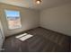 Sunlit bedroom with a large window offering a view of the surrounding neighborhood at 143 Steppe Way, Garner, NC 27529