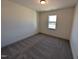 Cozy bedroom provides a relaxing retreat featuring soft carpeting and a bright window at 143 Steppe Way, Garner, NC 27529