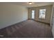 Bright bedroom featuring a door to a private outdoor space and large window for plenty of natural light at 143 Steppe Way, Garner, NC 27529