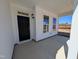Covered front porch with classic details, offering a glimpse of the home's exterior at 143 Steppe Way, Garner, NC 27529