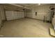 Spacious garage with ample room for vehicles and storage, featuring a garage door at 143 Steppe Way, Garner, NC 27529