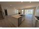 Bright, open kitchen boasts a large island, stainless steel appliances, and seamless flow to the living areas at 143 Steppe Way, Garner, NC 27529