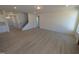 Spacious living room with hardwood floors, open layout, and neutral color palette at 143 Steppe Way, Garner, NC 27529