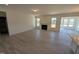 Open-concept living room featuring a fireplace, hardwood floors, and plenty of natural light at 143 Steppe Way, Garner, NC 27529