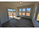 Inviting sunroom with sliding door access to the outside, flooding the space with natural light at 143 Steppe Way, Garner, NC 27529