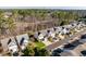 Aerial view of townhouses and tree-lined street at 152 Brentfield Loop, Morrisville, NC 27560