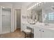 Elegant bathroom with double vanity, large mirror, and walk-in shower at 152 Brentfield Loop, Morrisville, NC 27560