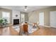 Bright living room features hardwood floors and fireplace at 152 Brentfield Loop, Morrisville, NC 27560