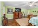 Spacious bedroom with wood dresser and large TV at 1699 Yorkshire Ln, Rocky Mount, NC 27803