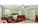 Light and airy bedroom with wood sleigh bed and en-suite access at 1699 Yorkshire Ln, Rocky Mount, NC 27803