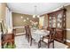 Formal dining room with hardwood floors and a china cabinet at 1699 Yorkshire Ln, Rocky Mount, NC 27803