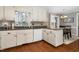 Efficient kitchen with granite countertops and white cabinets at 1699 Yorkshire Ln, Rocky Mount, NC 27803