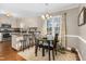 Kitchen features island with seating and updated appliances at 1699 Yorkshire Ln, Rocky Mount, NC 27803