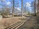 Spacious backyard with mature trees and a patio at 2011 Watkins St, Raleigh, NC 27604